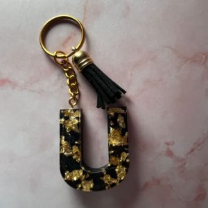 PORTE CLE U NOIR ET DOREE EN RESINE EPOXY